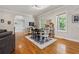 Bright dining area with hardwood floors, decorative rug, and view to another room at 4200 E Highway 166 Rd, Carrollton, GA 30116