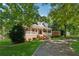 Inviting brick home with a wide front porch and a long driveway at 4200 E Highway 166 Rd, Carrollton, GA 30116