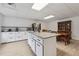 Spacious kitchen boasts a large island with granite counters, stainless appliances, and plenty of cabinet space at 4200 E Highway 166 Rd, Carrollton, GA 30116
