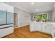Spacious kitchen featuring white cabinets, modern appliances, and hardwood floors at 4200 E Highway 166 Rd, Carrollton, GA 30116