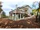 Backyard view features an elevated deck over a covered patio, offering versatile outdoor entertaining and living spaces at 6765 Crofton Dr, Alpharetta, GA 30005