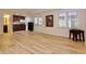 Finished basement with tile flooring, kitchenette, full bath, and walkout access to backyard at 6765 Crofton Dr, Alpharetta, GA 30005
