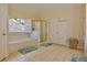 Spacious primary bath featuring garden tub, shower, and tile floors at 6765 Crofton Dr, Alpharetta, GA 30005
