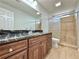 Elegant bathroom featuring granite counters, custom cabinets and tiled shower at 6765 Crofton Dr, Alpharetta, GA 30005