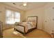 Cozy bedroom with a bed, window, and door, offering comfort and natural light at 6765 Crofton Dr, Alpharetta, GA 30005