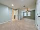 Bright bedroom featuring plush carpet and a ceiling fan at 6765 Crofton Dr, Alpharetta, GA 30005