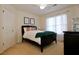 Comfortable bedroom with a black bed frame, window, and stylish decor at 6765 Crofton Dr, Alpharetta, GA 30005