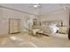 Spacious primary bedroom with tray ceiling, and carpet floors at 6765 Crofton Dr, Alpharetta, GA 30005