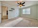 Comfortable bedroom with carpet, ceiling fan, natural light, and a spacious closet at 6765 Crofton Dr, Alpharetta, GA 30005