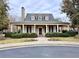 Charming community clubhouse with a welcoming entrance and manicured landscaping at 6765 Crofton Dr, Alpharetta, GA 30005