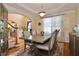 Traditional dining room with a large table, wainscoting, and ample natural light at 6765 Crofton Dr, Alpharetta, GA 30005