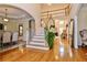 Bright foyer with hardwood floors and a staircase leading to the second floor at 6765 Crofton Dr, Alpharetta, GA 30005
