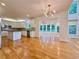 Open kitchen with white cabinets, granite countertops, stainless steel appliances, and island at 6765 Crofton Dr, Alpharetta, GA 30005