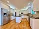 Spacious kitchen with white cabinets, granite countertops, and stainless steel appliances at 6765 Crofton Dr, Alpharetta, GA 30005