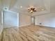 Open living room boasts stylish flooring, recessed lighting, and ample space for entertaining at 6765 Crofton Dr, Alpharetta, GA 30005