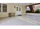 Covered patio with tile floor, ceiling detail, and access to landscaped backyard, perfect for relaxing and entertaining at 6765 Crofton Dr, Alpharetta, GA 30005