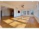 Bright sunroom with hardwood floors, large windows and a view of the Kitchen at 6765 Crofton Dr, Alpharetta, GA 30005