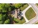 An aerial view shows an expansive yard, a patio area with outdoor seating, and a tree-lined property at 9742 Fallview Ct, Villa Rica, GA 30180