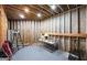 This unfinished basement features concrete floors, exposed beams, and recessed lighting to suit any needs at 9742 Fallview Ct, Villa Rica, GA 30180