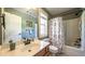 Clean bathroom featuring a modern vanity, updated fixtures, and a combination bathtub and shower at 9742 Fallview Ct, Villa Rica, GA 30180