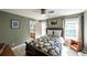 Cozy bedroom with a queen-sized bed, neutral walls, and ample natural light from the window at 9742 Fallview Ct, Villa Rica, GA 30180
