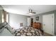 The main bedroom features a floral bedspread, ceiling fan, and private bathroom at 9742 Fallview Ct, Villa Rica, GA 30180