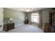 This bedroom suite has a large window providing natural light and is connected to an ensuite bathroom at 9742 Fallview Ct, Villa Rica, GA 30180