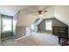 Angled ceilings and built-in storage make this room interesting and is lit by two windows and a fan at 9742 Fallview Ct, Villa Rica, GA 30180