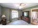 This bedroom suite is well-lit and leads to a bathroom through an archway for added privacy at 9742 Fallview Ct, Villa Rica, GA 30180