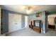 This bedroom features modern lighting and a closet for storage and is freshly painted at 9742 Fallview Ct, Villa Rica, GA 30180