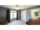 Inviting bedroom with blue walls, a large window, and closet with ample storage space at 9742 Fallview Ct, Villa Rica, GA 30180