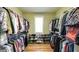 Spacious walk-in closet with custom shelves and plenty of storage at 9742 Fallview Ct, Villa Rica, GA 30180