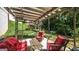 Cozy covered outdoor patio with comfortable seating area and views of the backyard at 9742 Fallview Ct, Villa Rica, GA 30180