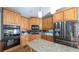 Bright kitchen features custom cabinets, granite countertops, and stainless steel appliances at 9742 Fallview Ct, Villa Rica, GA 30180