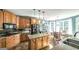 Bright kitchen featuring an island with light wood cabinets, granite countertops, and stainless steel appliances at 9742 Fallview Ct, Villa Rica, GA 30180