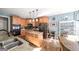 Bright kitchen featuring an island with light wood cabinets, granite countertops, and stainless steel appliances at 9742 Fallview Ct, Villa Rica, GA 30180