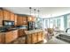 Open eat-in kitchen featuring custom cabinetry, an island with lighting, and a view of the backyard at 9742 Fallview Ct, Villa Rica, GA 30180
