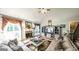 Bright living room featuring a fireplace, media center, and comfortable seating at 9742 Fallview Ct, Villa Rica, GA 30180