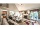 Open-concept living room features a fireplace, vaulted ceiling, and staircase to the upper level at 9742 Fallview Ct, Villa Rica, GA 30180
