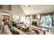 Bright living room featuring a fireplace, vaulted ceiling, and an open staircase, enhancing the home's spaciousness at 9742 Fallview Ct, Villa Rica, GA 30180