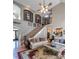 Spacious living room features a soaring ceiling, staircase, and an open layout to the kitchen at 9742 Fallview Ct, Villa Rica, GA 30180