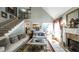 Open-concept living room features a fireplace, staircase, and seamless access to the kitchen at 9742 Fallview Ct, Villa Rica, GA 30180