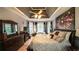 Spacious main bedroom features tray ceilings, a sitting area, and hardwood floors at 9742 Fallview Ct, Villa Rica, GA 30180