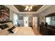 Large main bedroom with tray ceilings, hardwood floors, and an adjacent doorway at 9742 Fallview Ct, Villa Rica, GA 30180