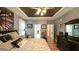 Spacious primary bedroom featuring a tray ceiling, dark wood floors, and a large bed at 9742 Fallview Ct, Villa Rica, GA 30180