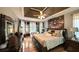 Beautiful main bedroom with trey ceilings, sitting area, and hardwood floors at 9742 Fallview Ct, Villa Rica, GA 30180