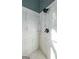 Modern shower featuring subway tile, glass doors, and a rainfall shower head at 9742 Fallview Ct, Villa Rica, GA 30180