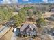 Aerial view of a two-story brick home surrounded by lush greenery and mature trees at 101 Lumby Ln, Stockbridge, GA 30281
