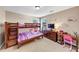 Comfortable bedroom featuring a bunk bed, dresser, desk, and playful decor at 101 Lumby Ln, Stockbridge, GA 30281