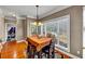 Bright dining area with natural light, a chandelier, and hardwood floors, ideal for Gathering meals at 101 Lumby Ln, Stockbridge, GA 30281